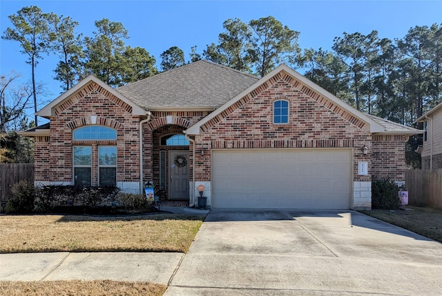 front facade with a garage and a front yard