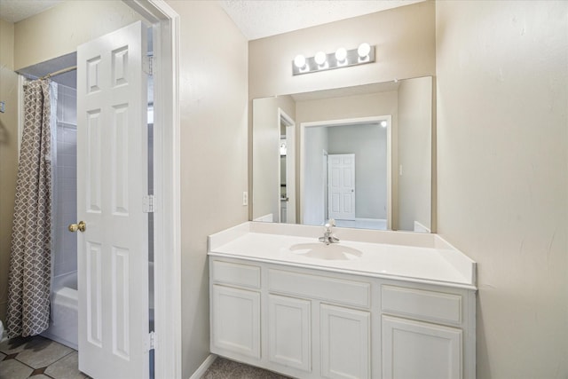 full bath featuring a textured ceiling, tile patterned floors, vanity, and shower / bathtub combination with curtain