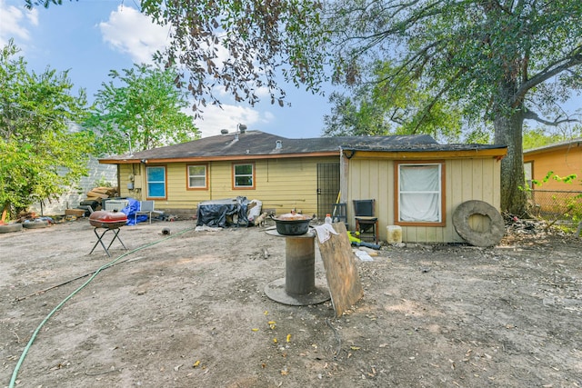 back of house with a patio