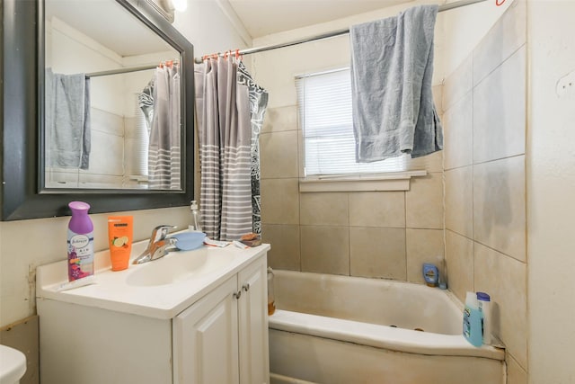 full bathroom with vanity, toilet, and shower / tub combo