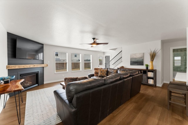 living room featuring ceiling fan and wood-type flooring