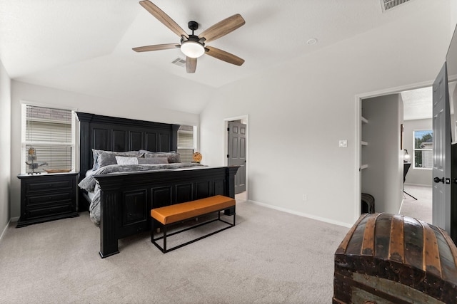 carpeted bedroom featuring vaulted ceiling and ceiling fan