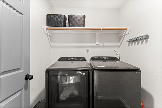 washroom featuring independent washer and dryer