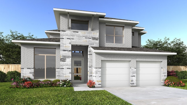 view of front of property featuring a garage and a front lawn