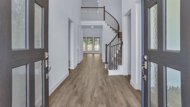 539 Oakview Bend Dr, Montgomery, TX 77316 - foyer entrance with a towering ceiling, baseboards, wood finished floors, and stairs