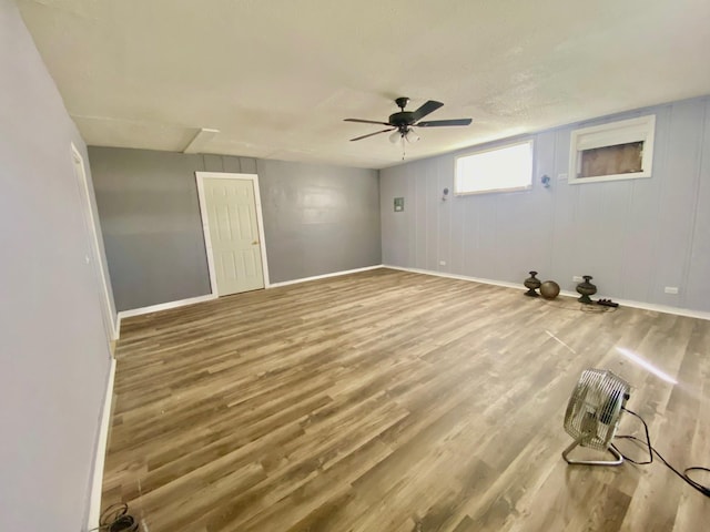 empty room featuring hardwood / wood-style flooring and ceiling fan