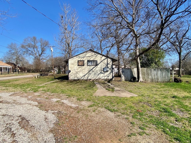 view of property exterior featuring a lawn