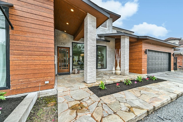 view of patio / terrace featuring a garage