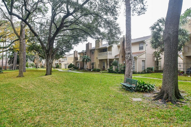 view of property's community with a yard