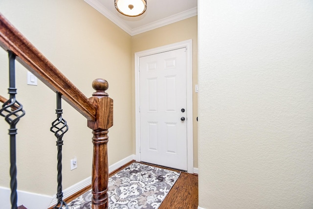 entrance foyer featuring ornamental molding and wood-type flooring