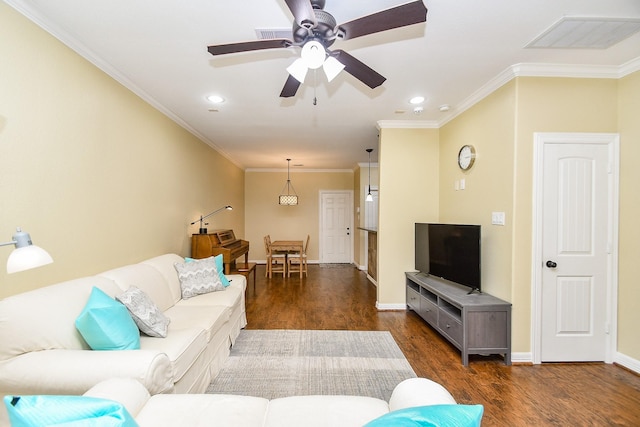 living room featuring ornamental molding, dark hardwood / wood-style floors, and ceiling fan