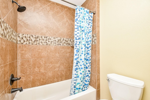 bathroom featuring toilet and shower / bath combo