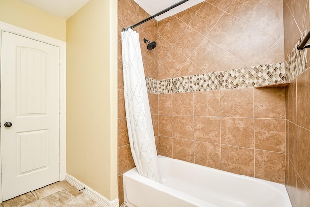 bathroom featuring shower / bath combo with shower curtain