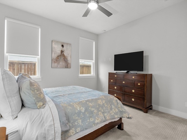 bedroom with light carpet and ceiling fan