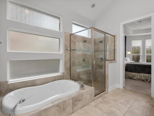 bathroom with lofted ceiling, tile patterned floors, and independent shower and bath