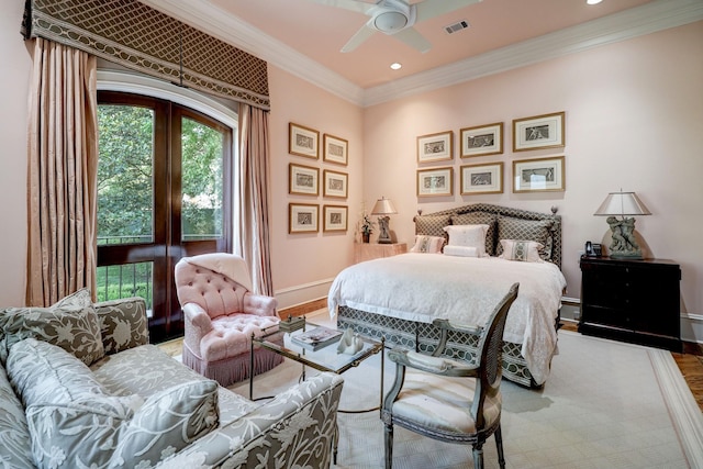 bedroom with crown molding, ceiling fan, and hardwood / wood-style floors