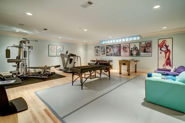 rec room featuring crown molding and hardwood / wood-style floors