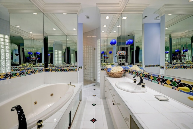 bathroom featuring tile patterned flooring, vanity, separate shower and tub, and crown molding