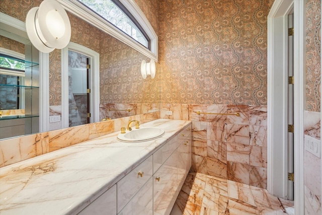 bathroom featuring a healthy amount of sunlight and vanity