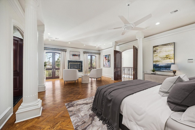 bedroom featuring ornamental molding, access to outside, dark parquet floors, and ornate columns