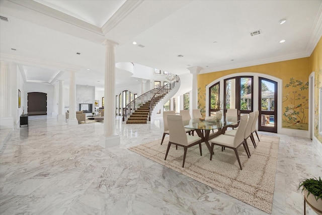 unfurnished dining area featuring ornate columns and crown molding