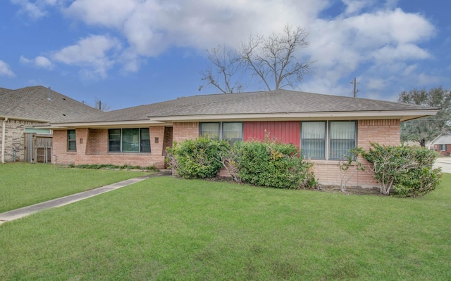 ranch-style home with a front yard