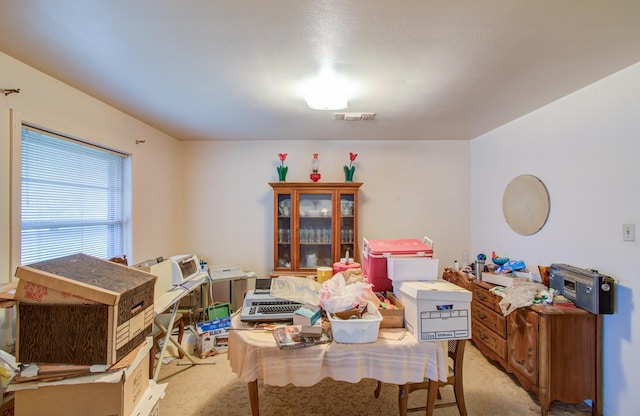 dining space with light colored carpet