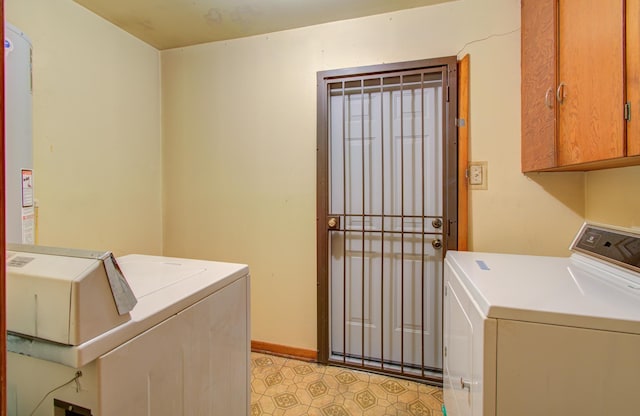 washroom with washer and clothes dryer and cabinets