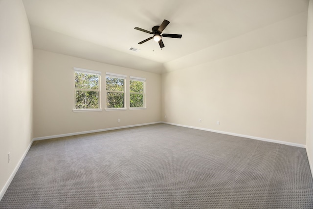 unfurnished room with vaulted ceiling, carpet floors, and ceiling fan