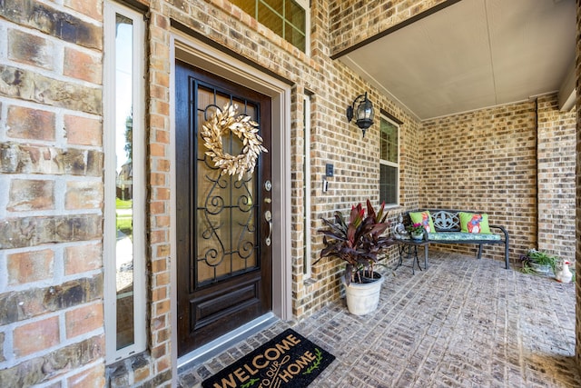 doorway to property featuring a porch