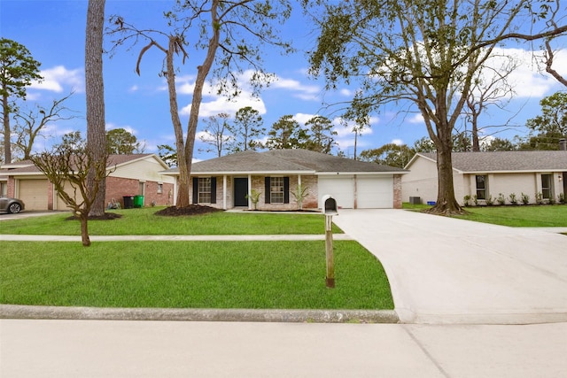 ranch-style house featuring a garage and a front yard