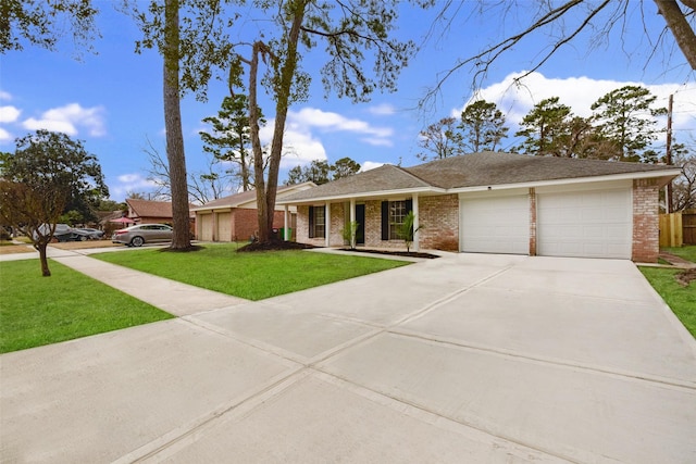 ranch-style house with a garage and a front lawn