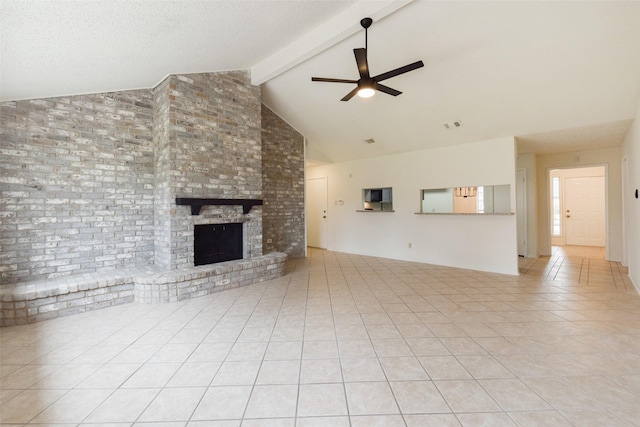 unfurnished living room featuring high vaulted ceiling, a brick fireplace, light tile patterned floors, ceiling fan, and beam ceiling