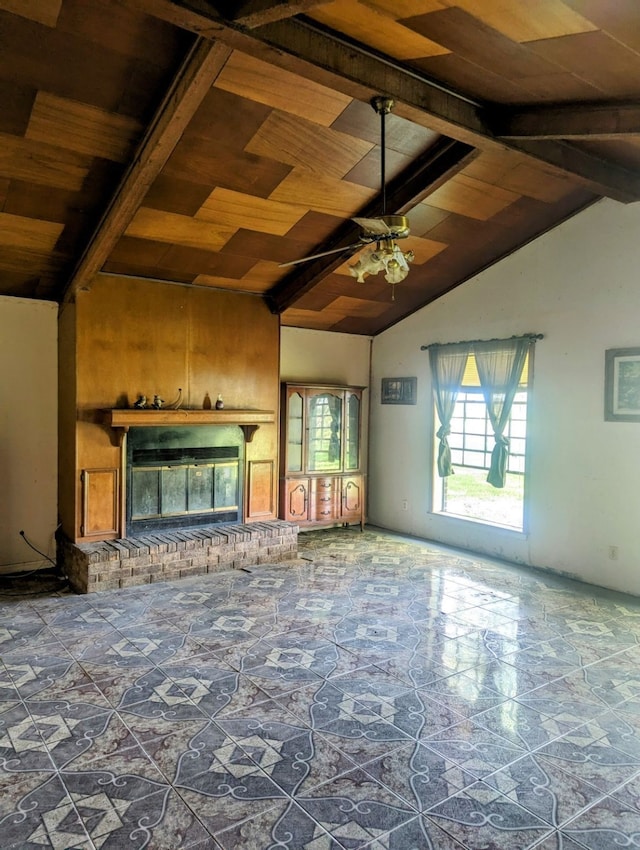 1946 County Road 109, Devers, TX 77538 - unfurnished living room with ceiling fan, wooden ceiling, a fireplace, and vaulted ceiling with beams