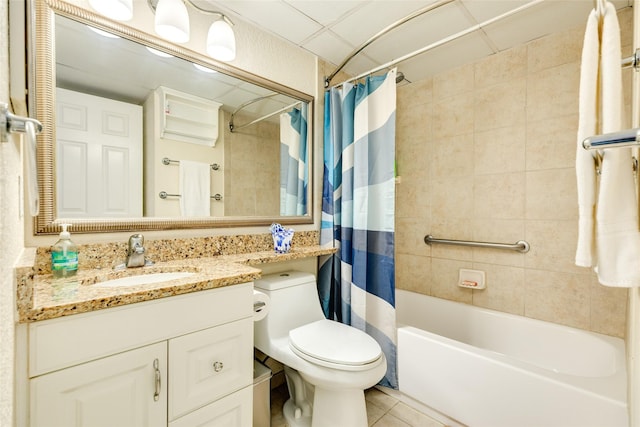 full bathroom featuring tile patterned flooring, vanity, toilet, and shower / bath combo with shower curtain