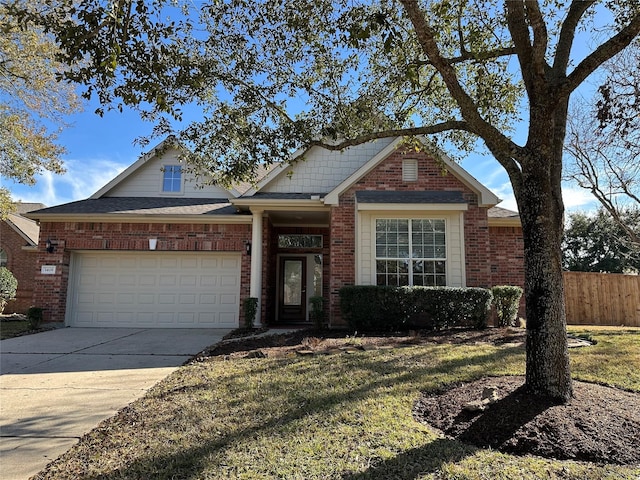 view of front facade featuring a garage and a front yard