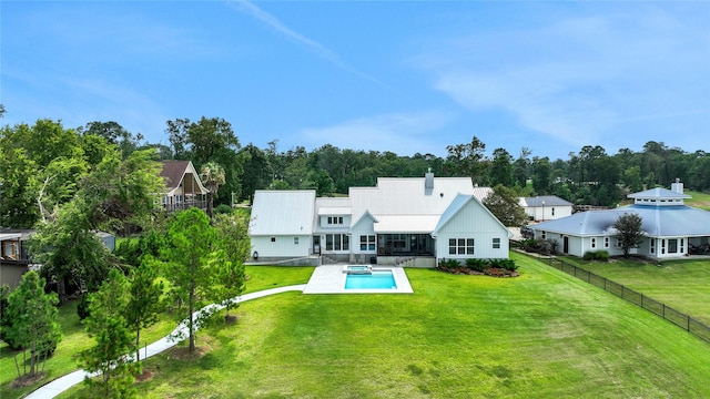 back of property featuring a patio and a yard