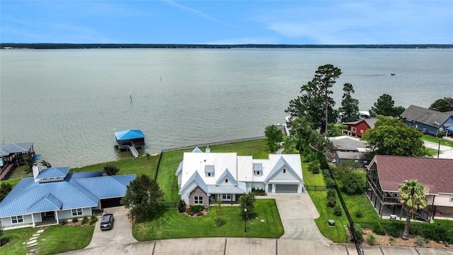 birds eye view of property featuring a water view