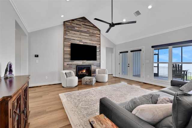 living room with crown molding, high vaulted ceiling, light hardwood / wood-style flooring, ceiling fan, and a fireplace