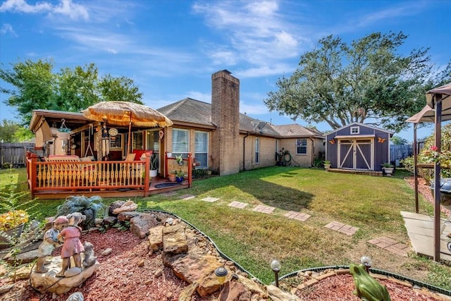 view of yard with a deck and a storage shed