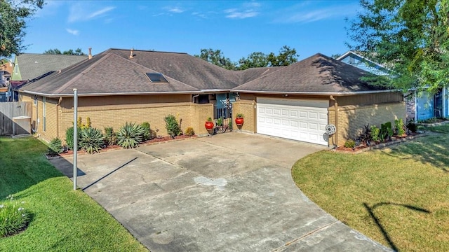 ranch-style house featuring a garage and a front yard