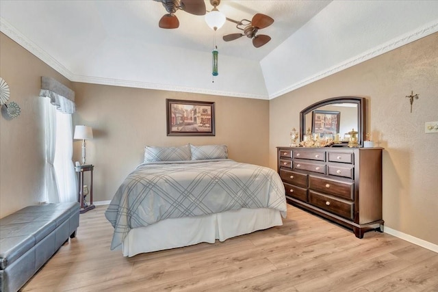 bedroom with crown molding, ceiling fan, lofted ceiling, and light hardwood / wood-style flooring