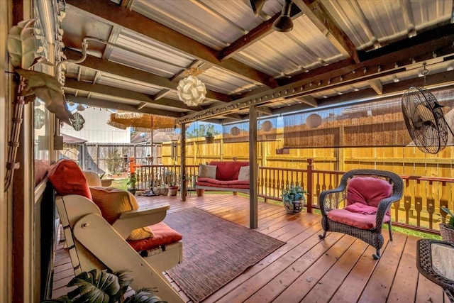 wooden terrace featuring ceiling fan