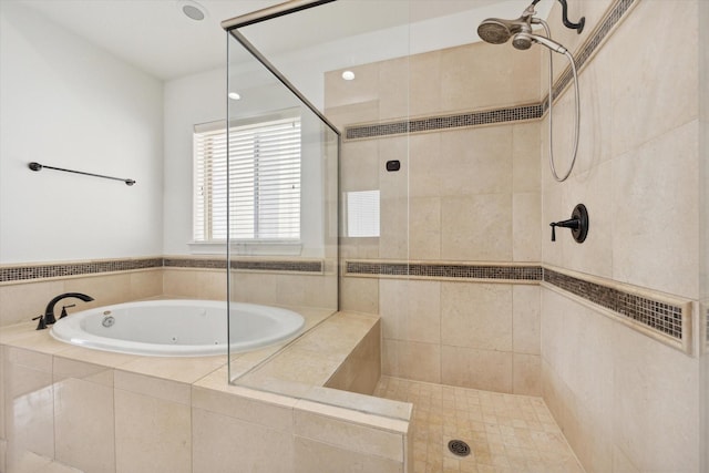 bathroom with separate shower and tub