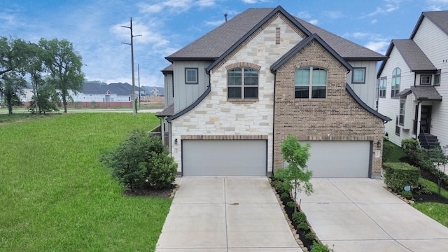 view of front of house featuring a garage and a front yard