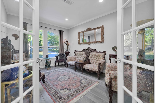 interior space featuring recessed lighting, visible vents, ornamental molding, and french doors