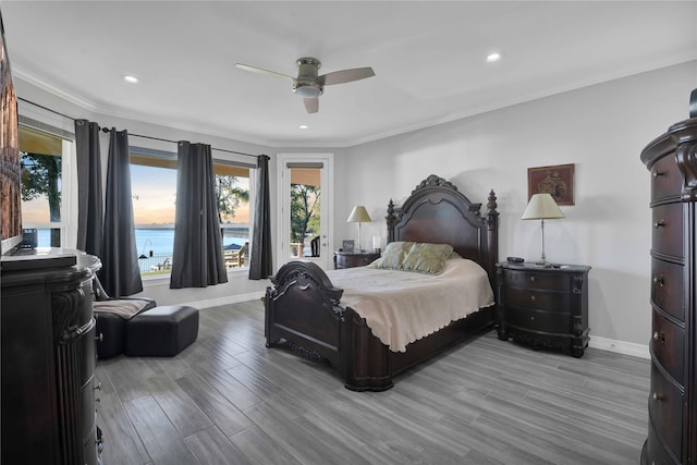 bedroom featuring a ceiling fan, recessed lighting, wood finished floors, and baseboards