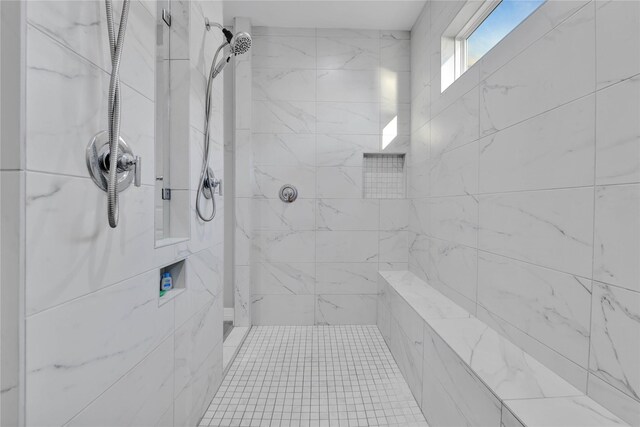 bathroom with tiled shower