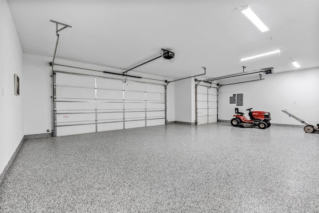 garage with electric panel, a garage door opener, and baseboards