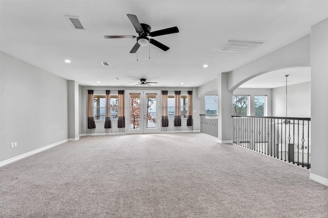 spare room featuring recessed lighting, a healthy amount of sunlight, and carpet floors